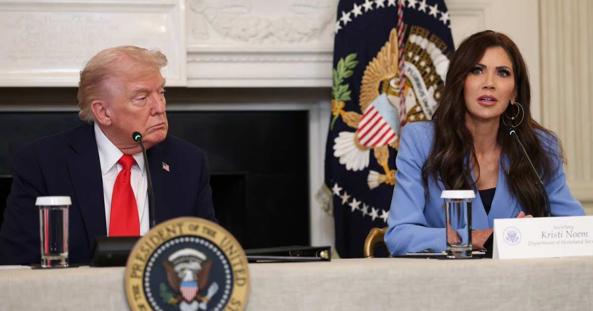 Kristi Noem (R) speaks as President Donald Trump listens during a roundtable discussion in the State Dining Room of the White House on October 08, 2025(Cover Image Source: Getty Images | Photo by Anna Moneymaker)