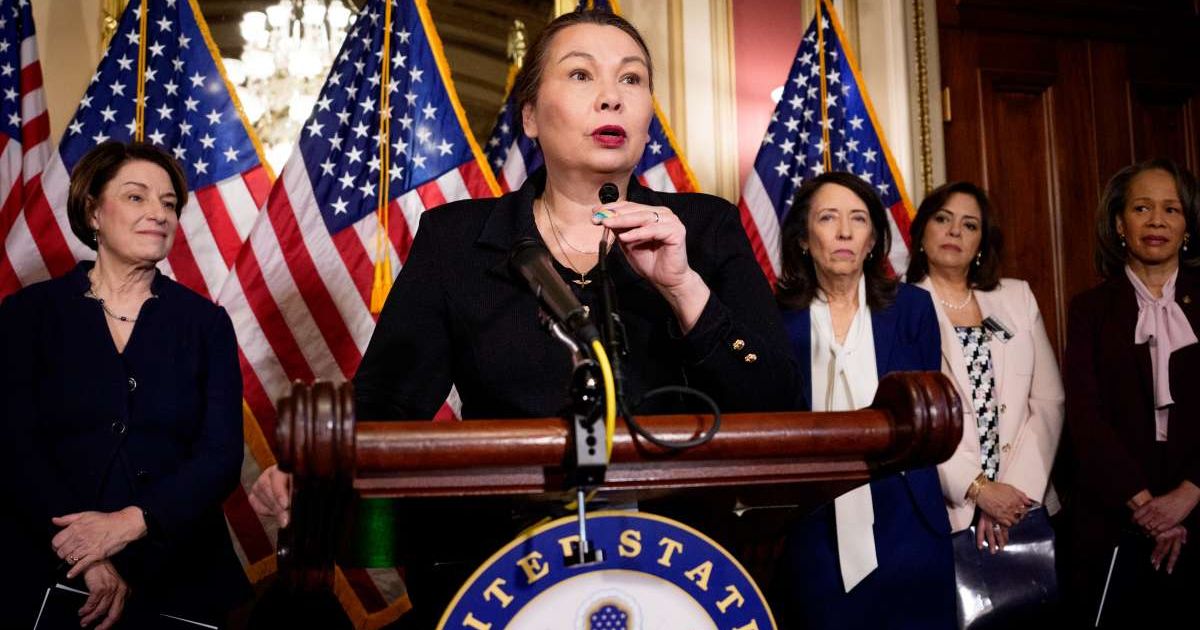 Sen. Tammy Duckworth (D-IL) (C) speaks during a news conference titled "Exposing Trump's Costs, Chaos, and Corruption During His First Year Back in Office" at the U.S. Capitol Building on February 24, 2026 (Cover Image Source: Getty Images | Photo by Andr