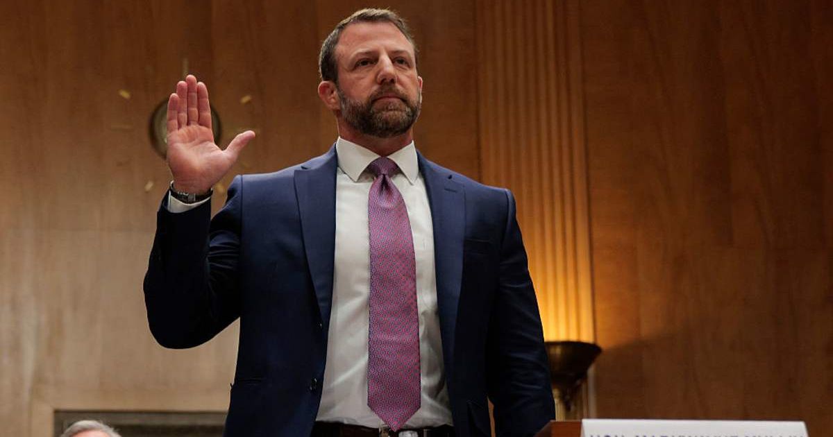 U.S. Sen. Markwayne Mullin (R-OK) is sworn in as he testifies during a confirmation hearing to be the next Secretary of the Department of Homeland Security (Cover image source: Getty Images/Photo by Chip Somodevilla)
