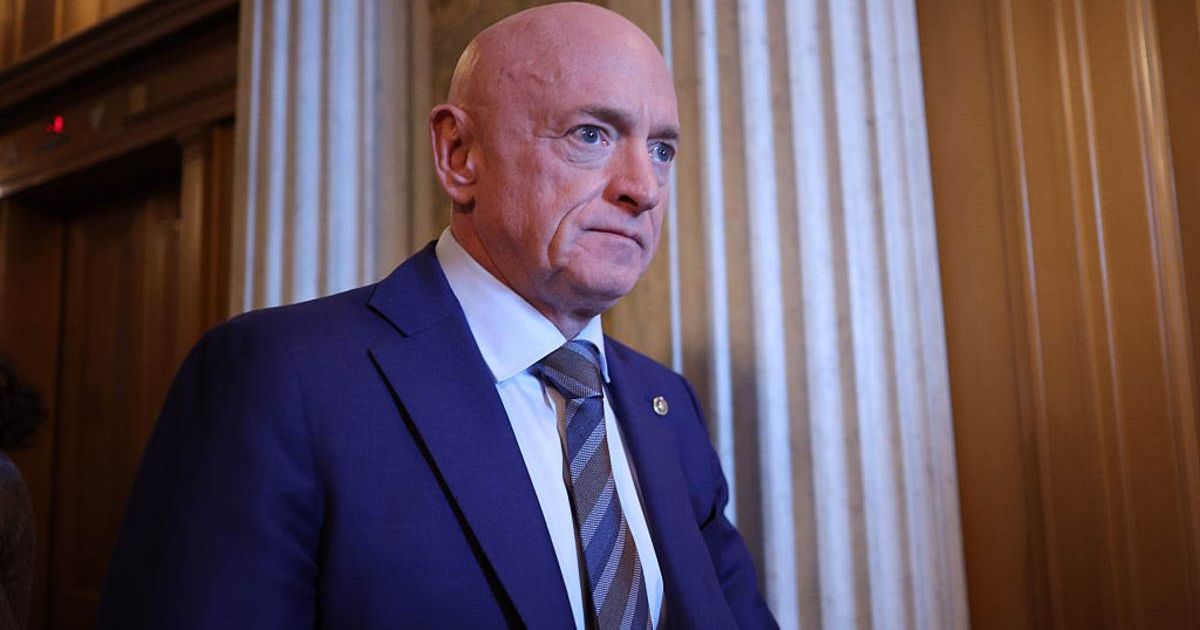 Sen. Mark Kelly (D-AZ) leaves after the Senate voted on the Venezuela War Powers Resolution at the U.S. Capitol (Image source: Getty Images/Photo by Kevin Dietsch)