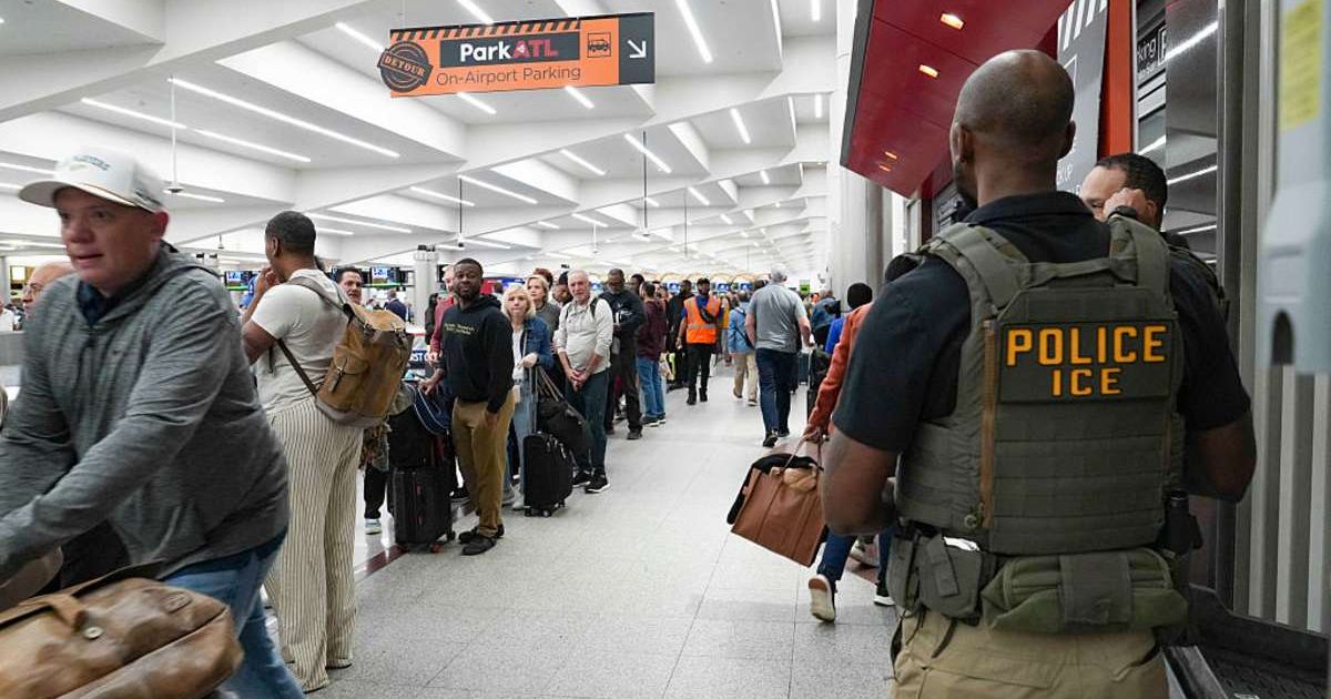 ICE agents look on as travelers stand in long lines at Atlanta Hartsfield-Jackson International Airport (Cover Image Source: Getty Images | Photo by Megan Varner)