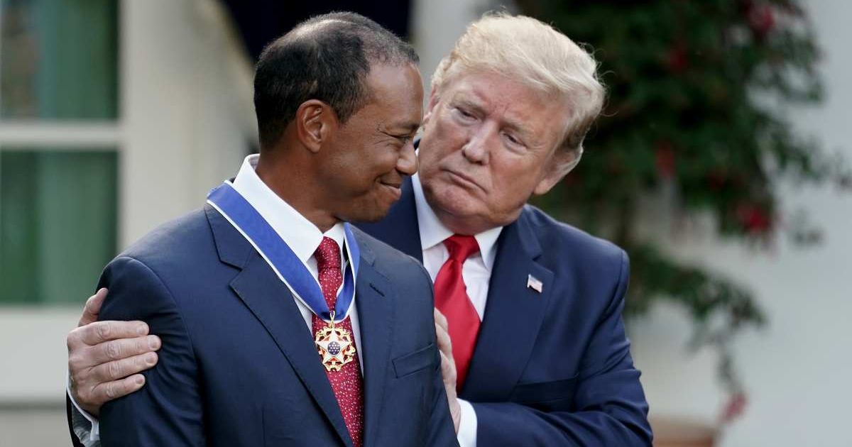 President Donald Trump gives professional golfer and business partner Tiger Woods the Medal of Freedom during a ceremony in the Rose Garden at the White House May 06, 2019 in Washington, DC, (Cover Image Source: Getty Images | Photo by Chip Somodevilla)