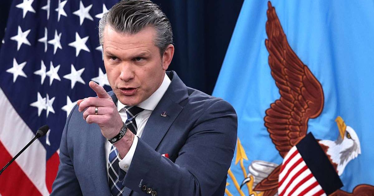Secretary of War Pete Hegseth speaks at a press briefing on the Iran war at the Pentagon (Cover Image Source: Getty Images | Photo by Win McNamee)