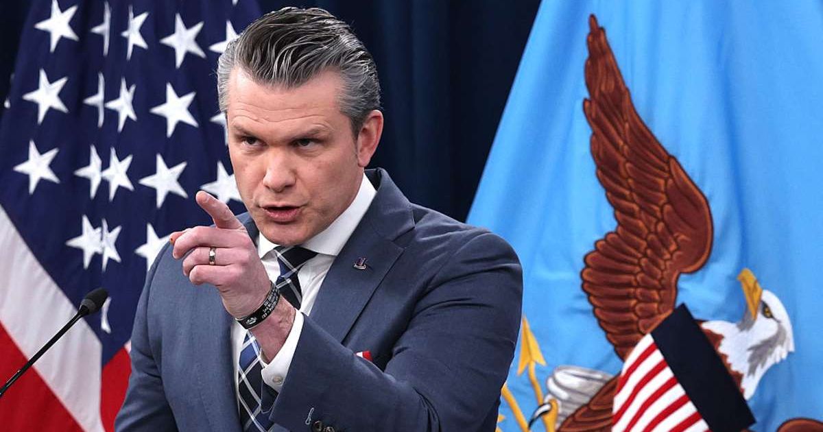 Secretary of War Pete Hegseth during a press briefing on the Iran war at the Pentagon (Cover Image Source: Getty Images | Photo by Win McNamee)