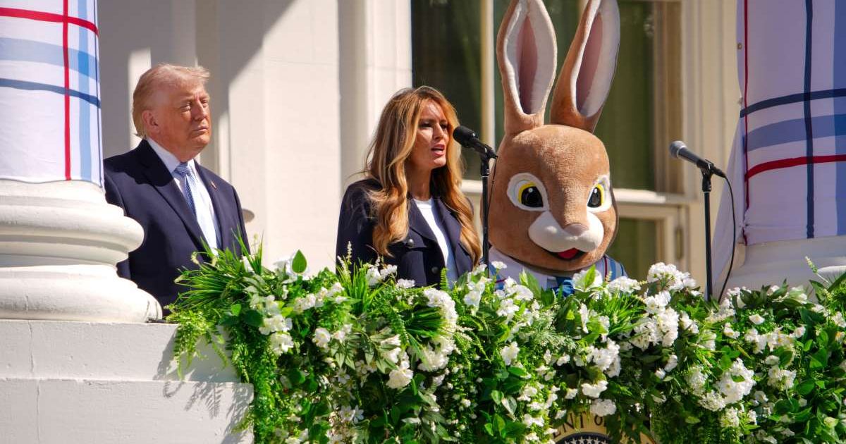 President Donald Trump (L) and a person dressed as the Easter Bunny look on as Melania Trump speaks on the balcony during the White House Easter Egg Roll (Cover Image Source: Getty Images | Photo by Andrew Harnik)