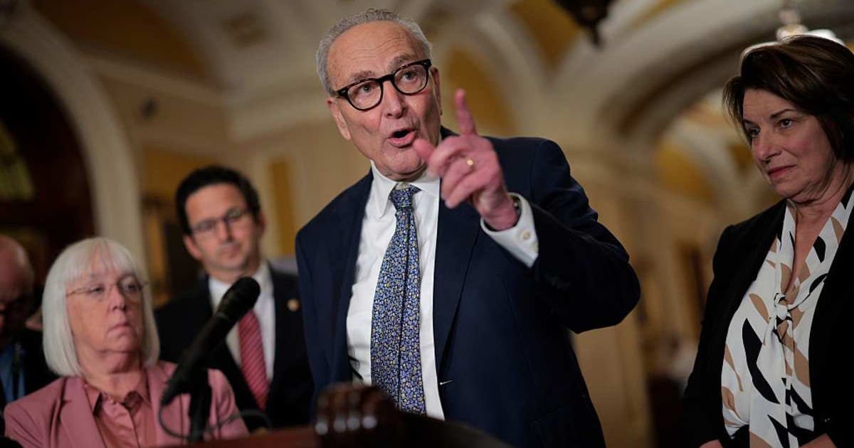 Senate Minority Leader Charles Schumer (D-NY) (C) talks to reporters following the weekly Senate Democratic policy luncheon at the U.S. Capitol (Cover Image Source: Getty Images | Photo by Chip Somodevilla)