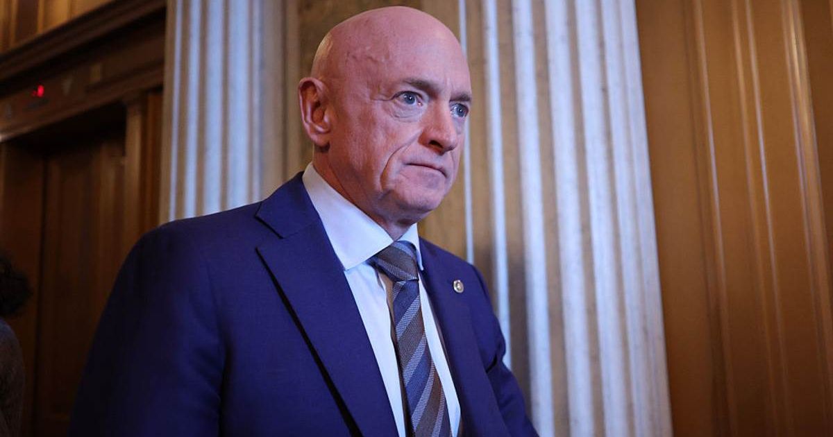 Sen. Mark Kelly (D-AZ) leaves after the Senate voted on the Venezuela War Powers Resolution at the U.S. Capitol (Cover Image Source: Getty Images | Photo by Kevin Dietsch)