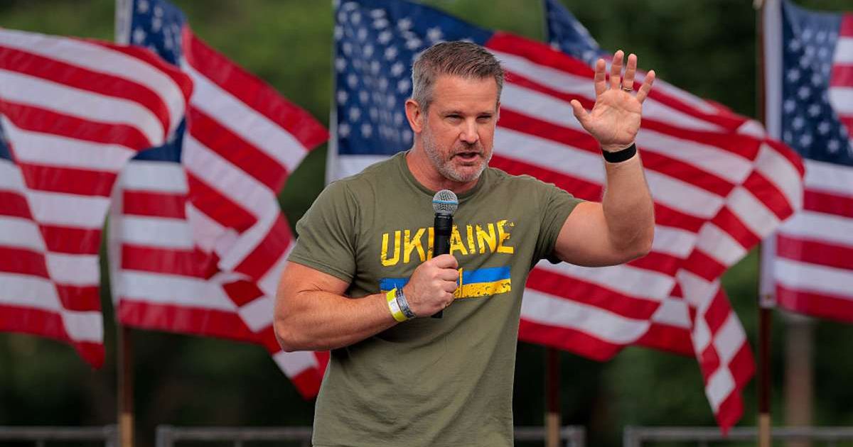 Adam Kinzinger addresses a rally on the National Mall in Washington, DC. (Image Source: Getty Images | Photo by Chip Somodevilla)