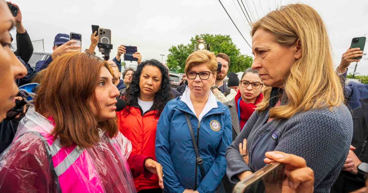 NJ Governor Mikie Sherrill (R) speaks to a demonstrator (Cover Image Source: X | @GovSherrillNJ)
