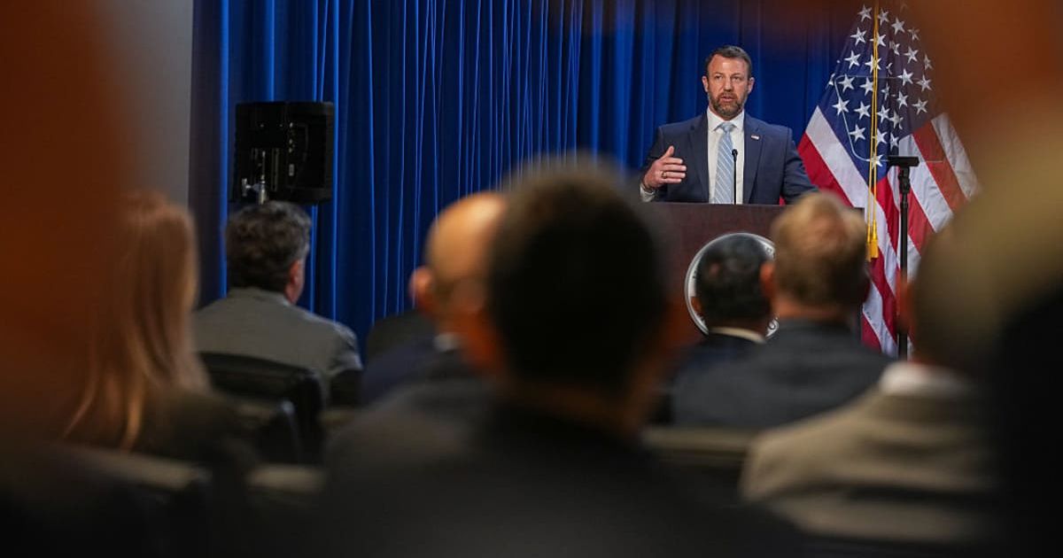 U.S. Secretary of the Department of Homeland Security Markwayne Mullin speaks during an event for National Police Week at the U.S. Immigration and Customs Enforcement (ICE) headquarters on May 13, 2026 (Cover Image Source: Getty Images | Photo by Andrew H