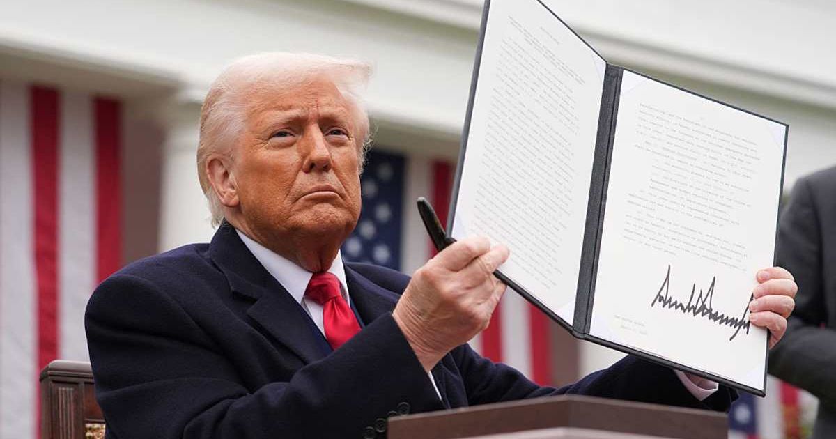 President Donald Trump displays a signed executive order imposing tariffs on imported goods during a "Make America Wealthy Again" trade announcement event  (Cover Image Source: Getty Images | Photo by Andrew Harnik)