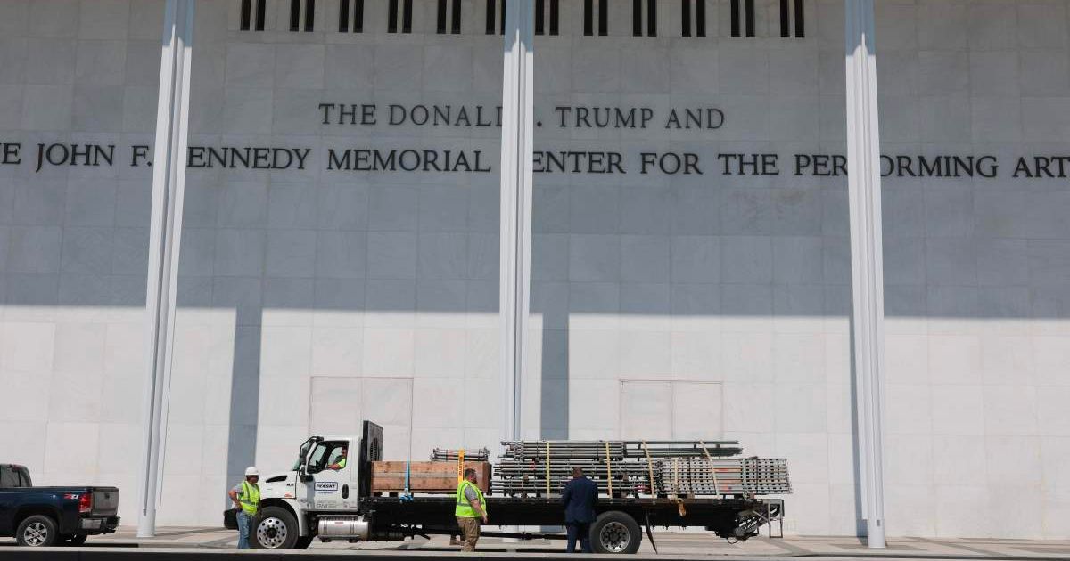 A truck with construction equipment parks below the sign for the Donald J. Trump and John F. Kennedy Memorial Center for the Performing Arts in Washington, DC (Cover Image Source: Getty Images | Photo by Anna Moneymaker)