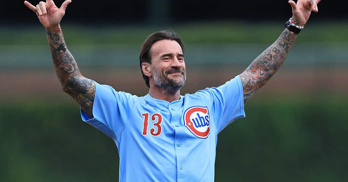 Wrestler CM Punk throws out the first pitch before a game between the Chicago Cubs and the Washington Nationals at Wrigley Field (Cover Image Source: Getty Images | Photo by Geoff Stellfox)