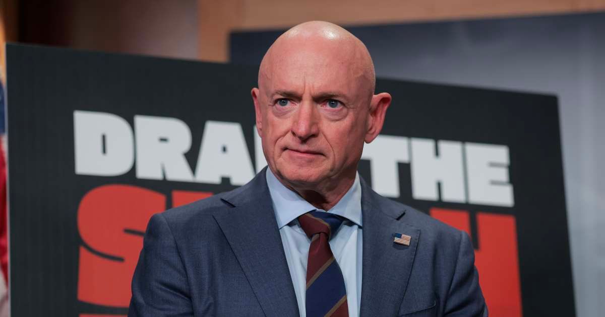 Sen. Mark Kelly (D-AZ) listens during a news conference at the U.S. Capitol in Washington, DC. (Cover Image Source: Getty Images | Photo by Anna Moneymaker)