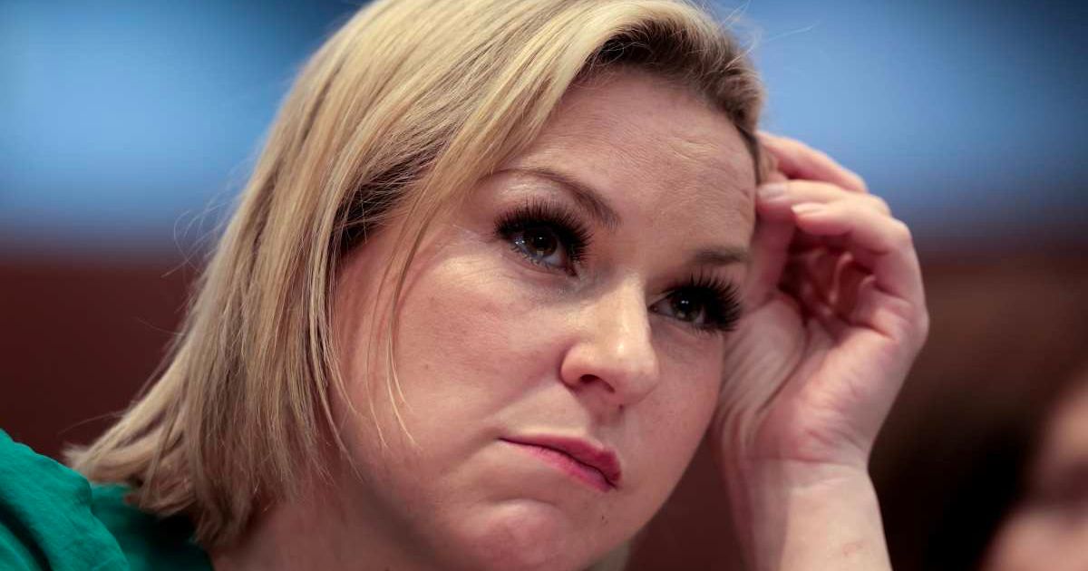 Dani Hannah Bensky, who is a victim of Jeffrey Epstein, listens during a House Oversight Committee hearing at West Palm Beach City Hall in West Palm Beach, Florida (Cover Image Source: Getty Images | Photo by Joe Raedle)