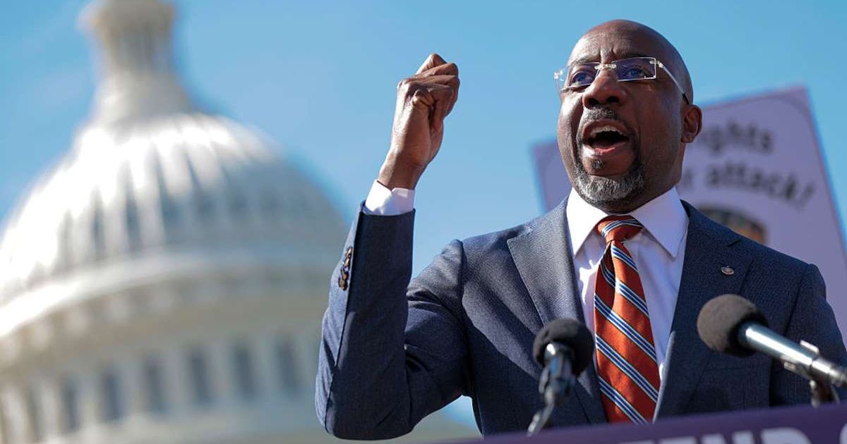 Sen. Raphael Warnock attends a rally outside the U.S. Capitol in Washington, DC. (Image Source: Getty Images | Photo by Heather Diehl)