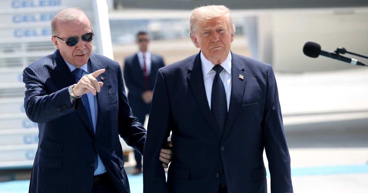 President Donald Trump (R) greets Turkish President Recep Tayyip Erdogan (L) as he arrives at Etimesgut Air Base for the annual NATO Summit in Turkey (Cover Image Source: Getty Images | Photo by Win McNamee)