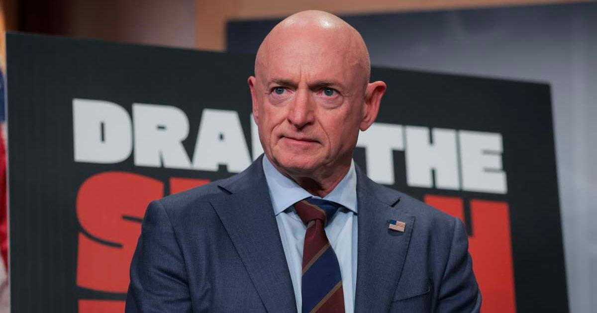 Mark Kelly (D-AZ) listens during a news conference at the U.S. Capitol in Washington, DC (Cover Image Source: Getty Images | Photo by Anna Moneymaker)