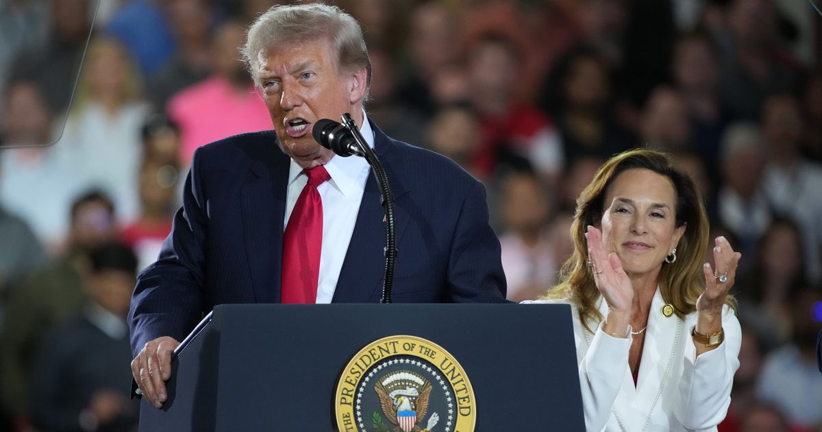 U.S. President Donald Trump speaks as Rep. Lisa McClain (R-MI) claps at General Motors' Milford Proving Grounds on July 27, 2026 in Milford, Michigan (Cover Image Source: Getty Images | Photo by Andrew Harnik)
