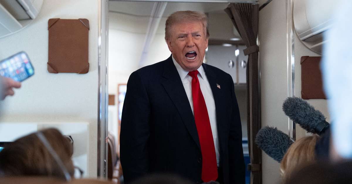 President Donald Trump speaks with reporters while on Air Force One en route to Oakland County International Airport (Cover Image Source: AP Photo | Photo by Alex Brandon)